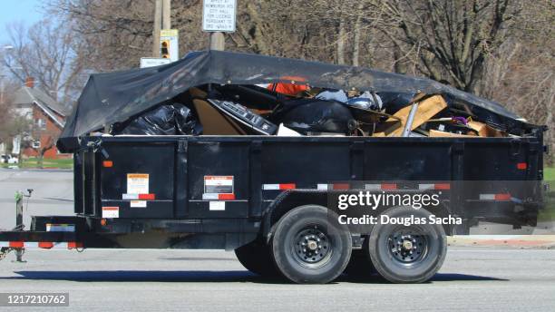 Dump trailer filled with trash and mixed cleanup waste